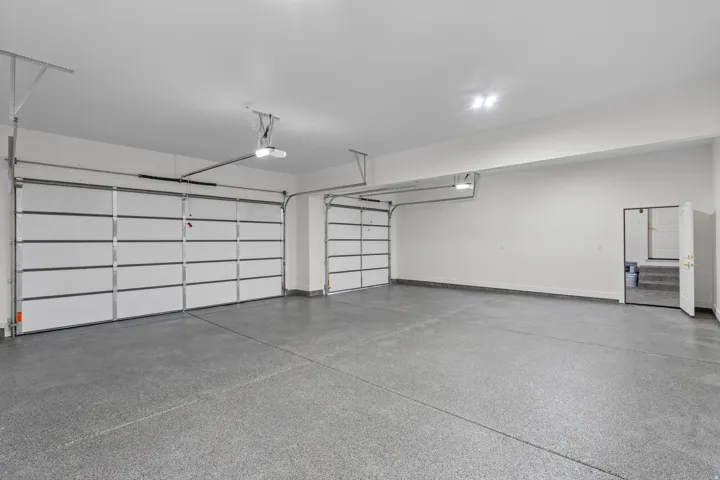 Garage featuring baseboards