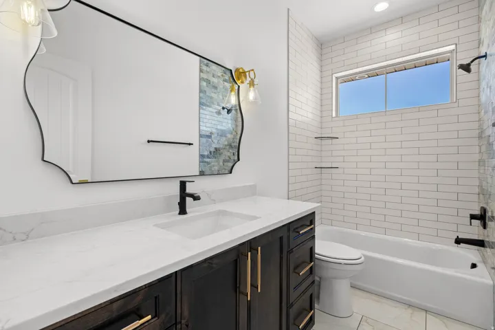 Bathroom with vanity and shower / bath combination