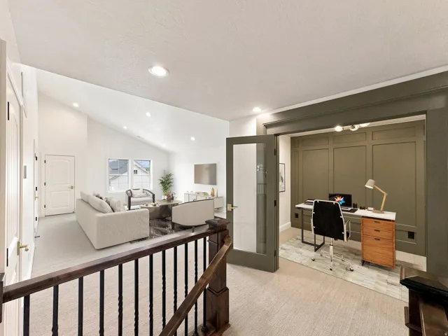 Dedicated office space with paneling detail and frosted glass French doors