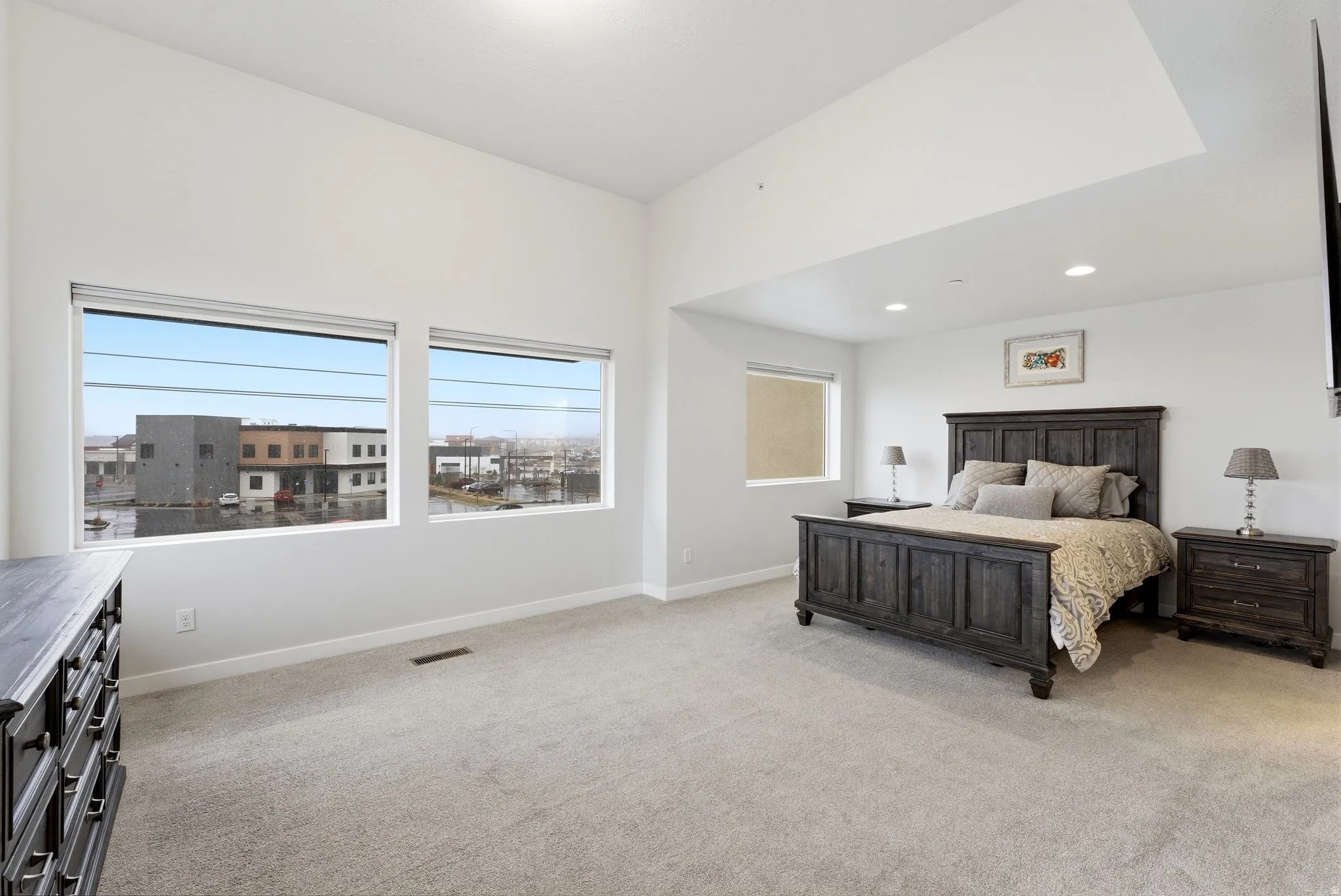 Bedroom featuring light colored carpet and recessed lighting