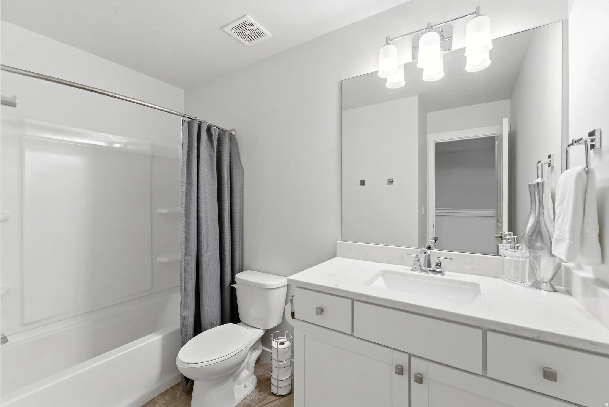 Full bathroom with vanity and shower / bathtub combination with curtain