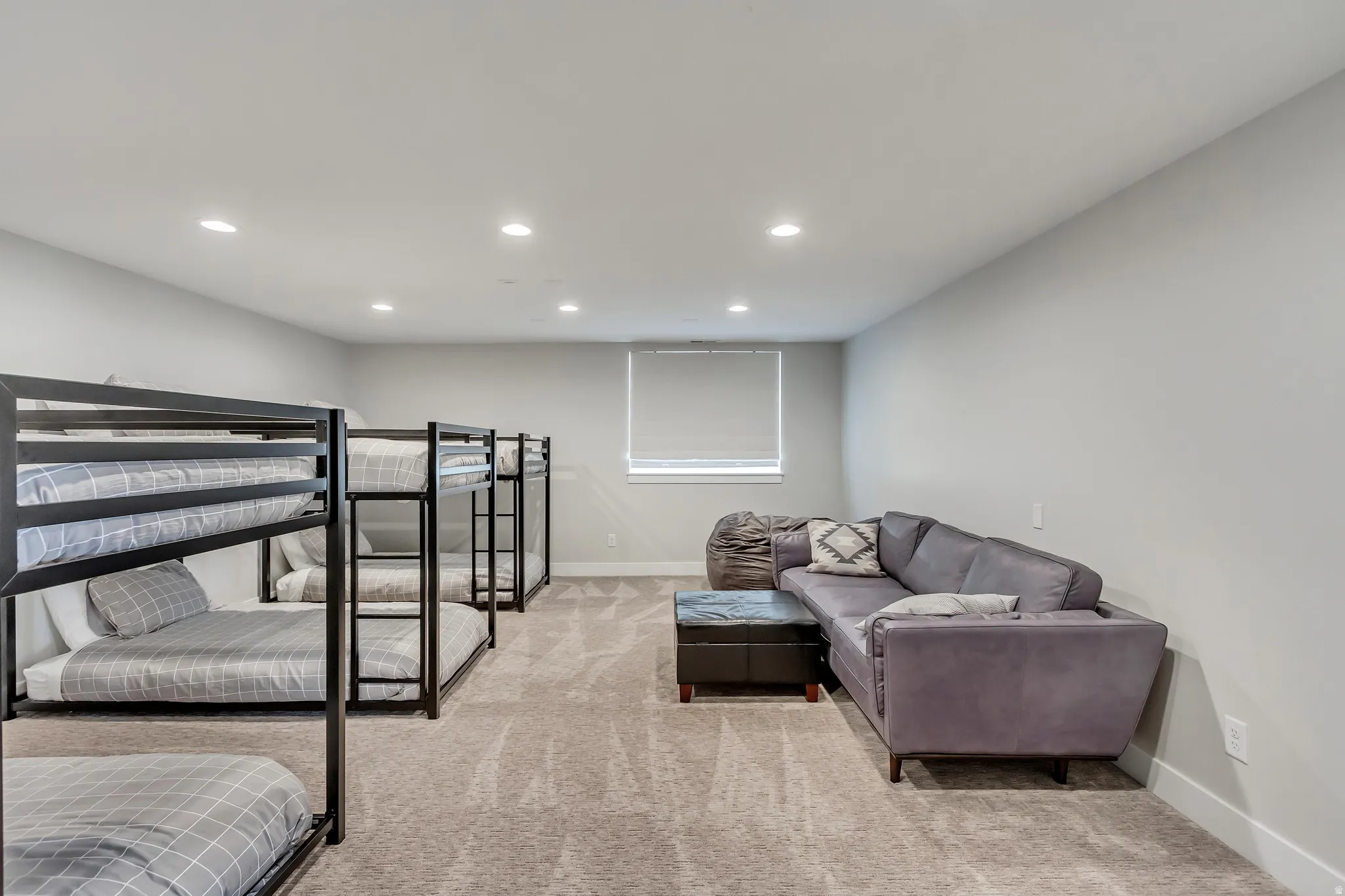 Living area featuring recessed lighting and light carpet