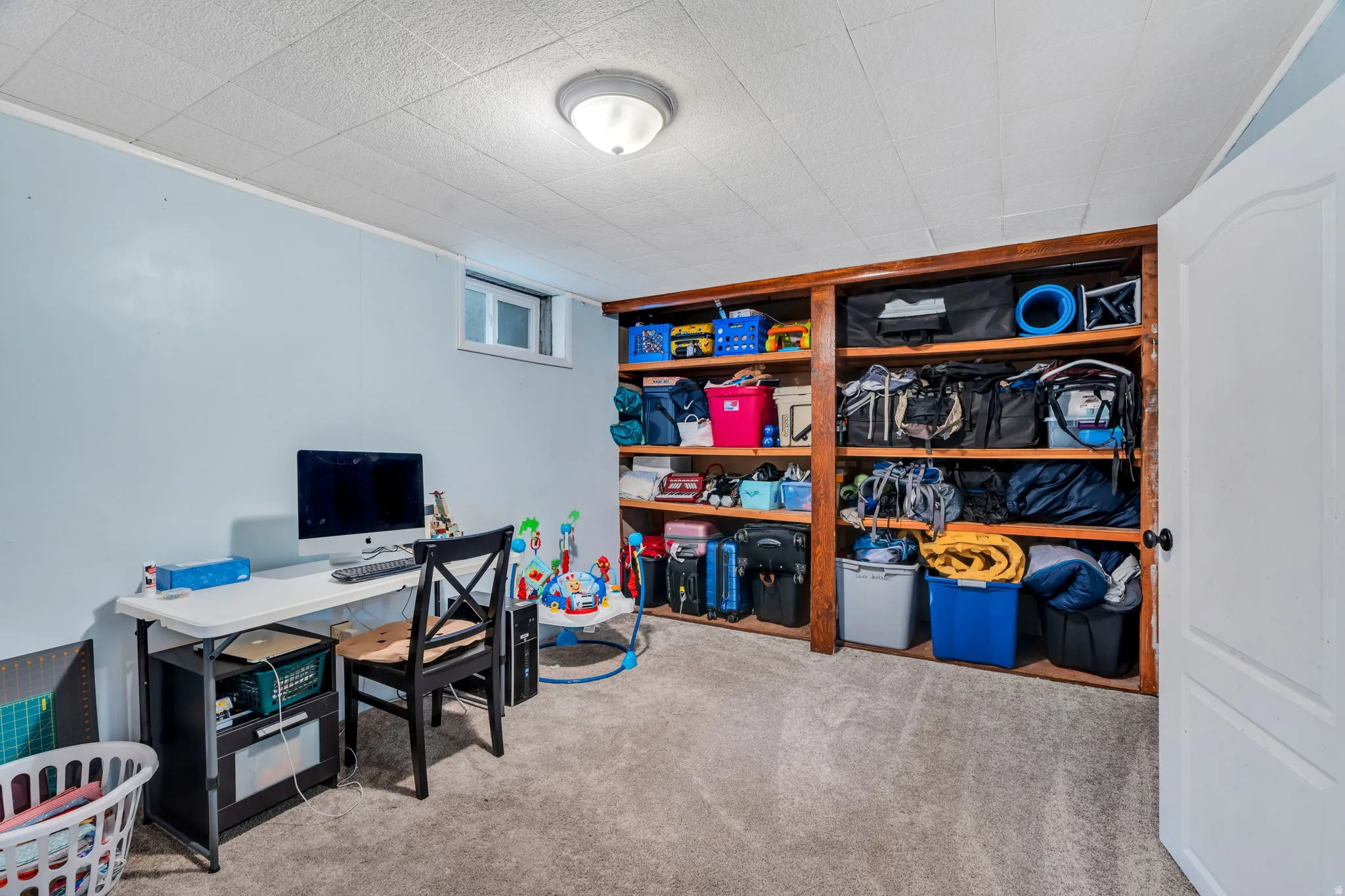 Home office featuring light colored carpet