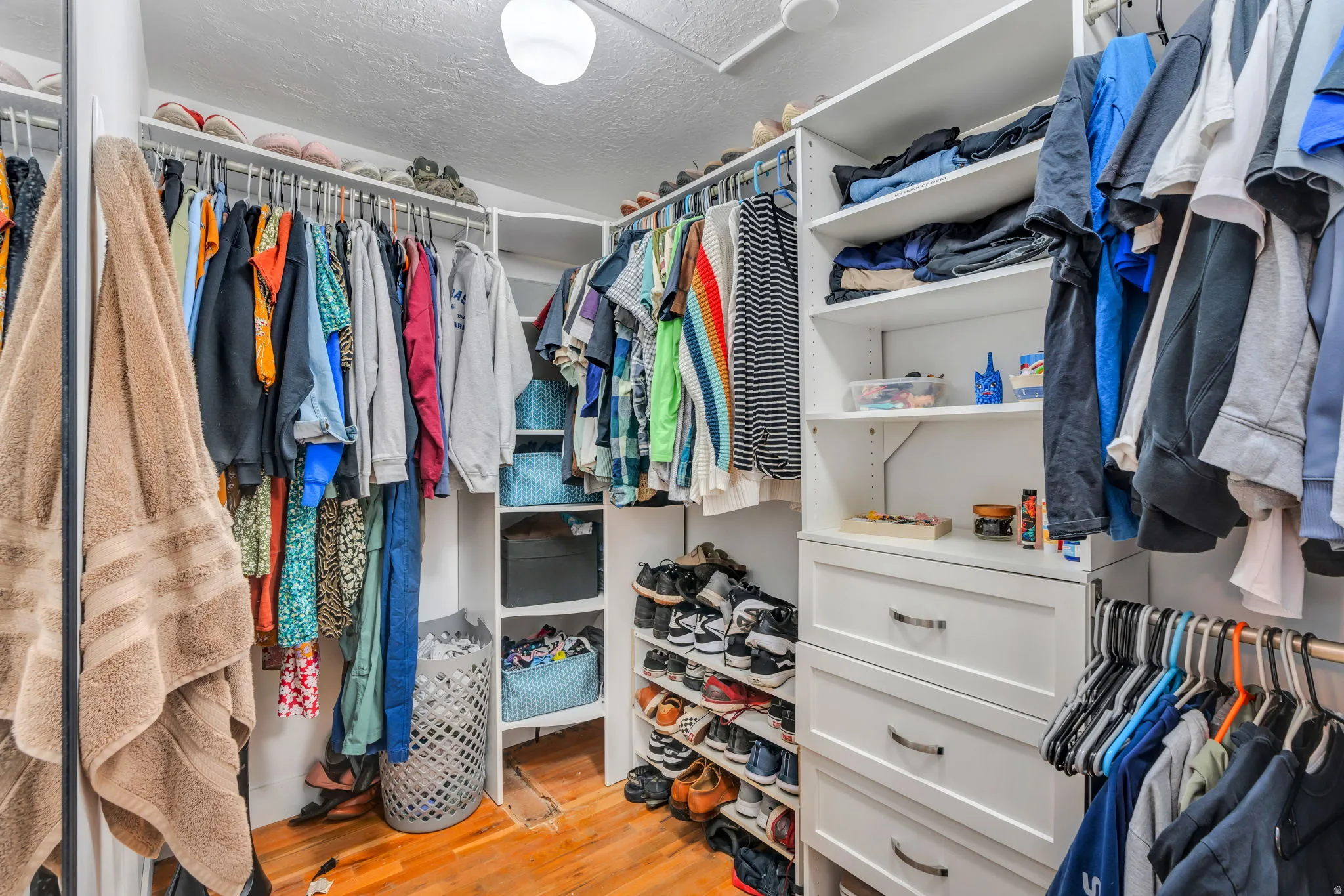 Walk in closet featuring light wood finished floors