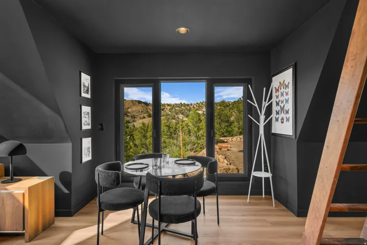 Dining space with light wood-type flooring and baseboards
