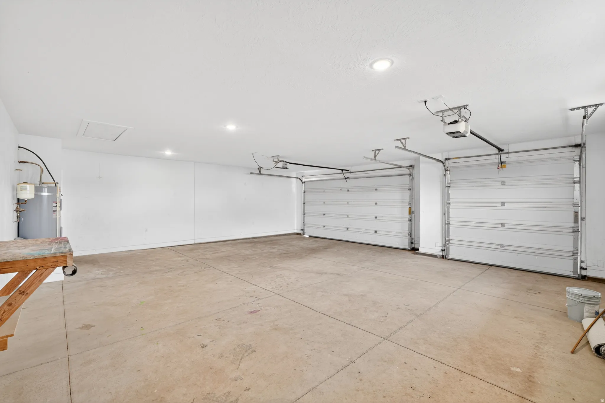 864 Sq Feet Garage with strapped water heater and recessed lighting