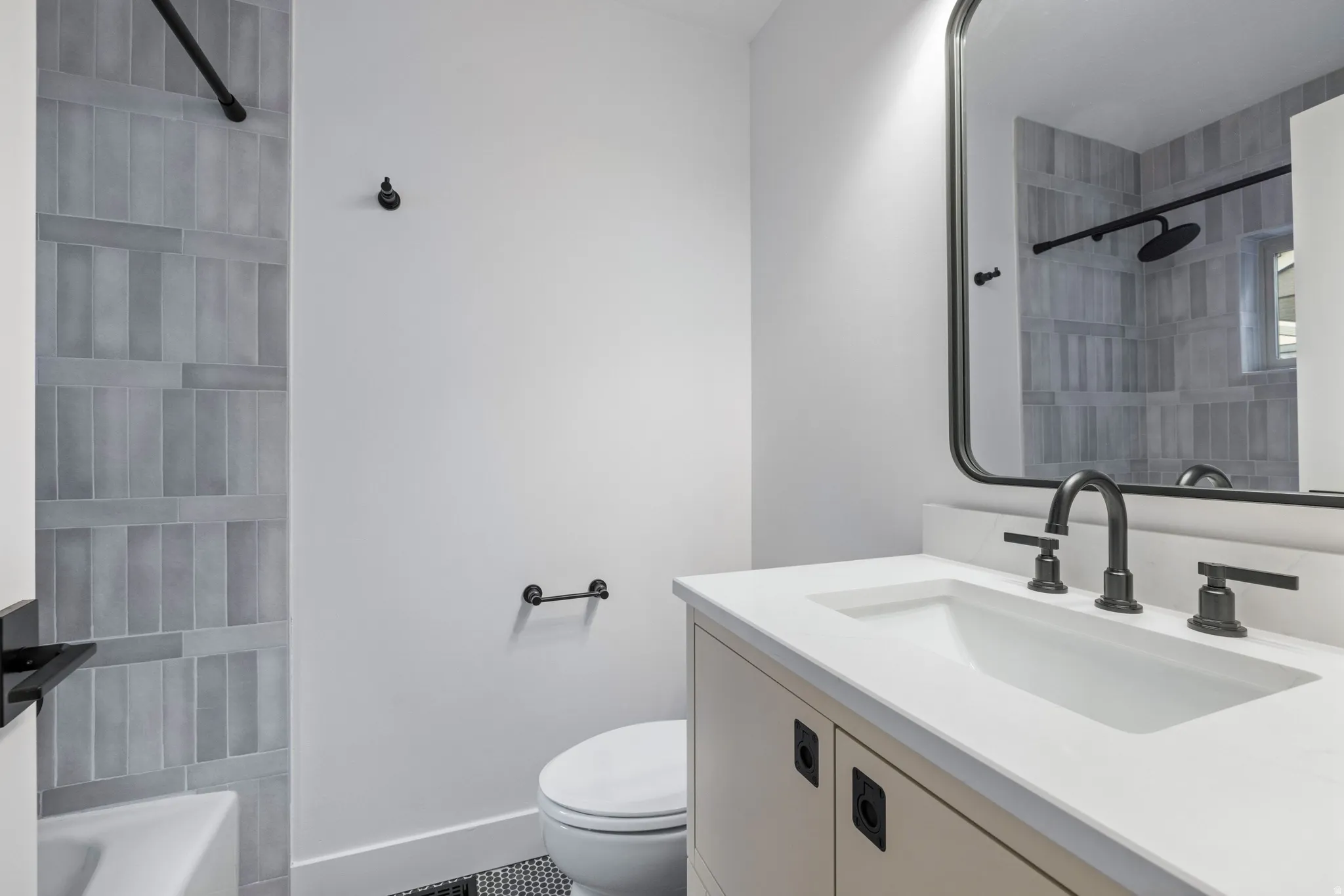 Full bath featuring vanity and toilet