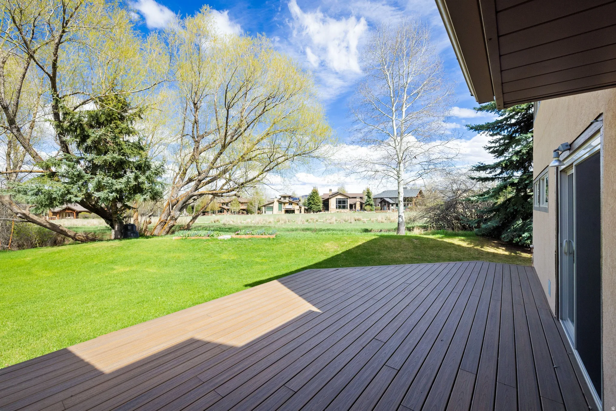 Deck featuring a lawn