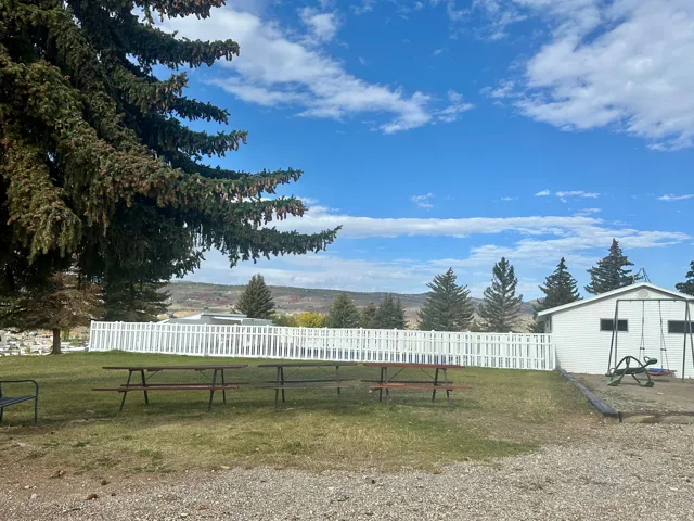 Picnic and grass area by pool