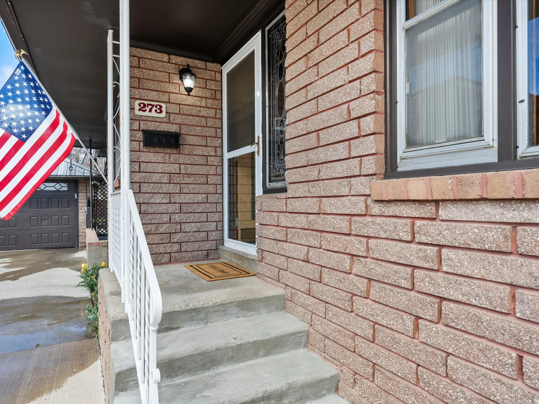 Property entrance with brick siding