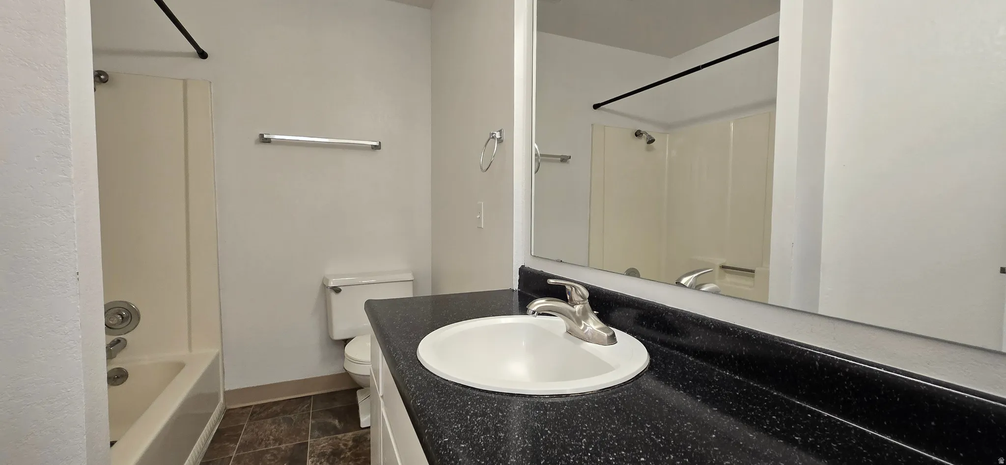 Full bath with shower / bath combination and vanity