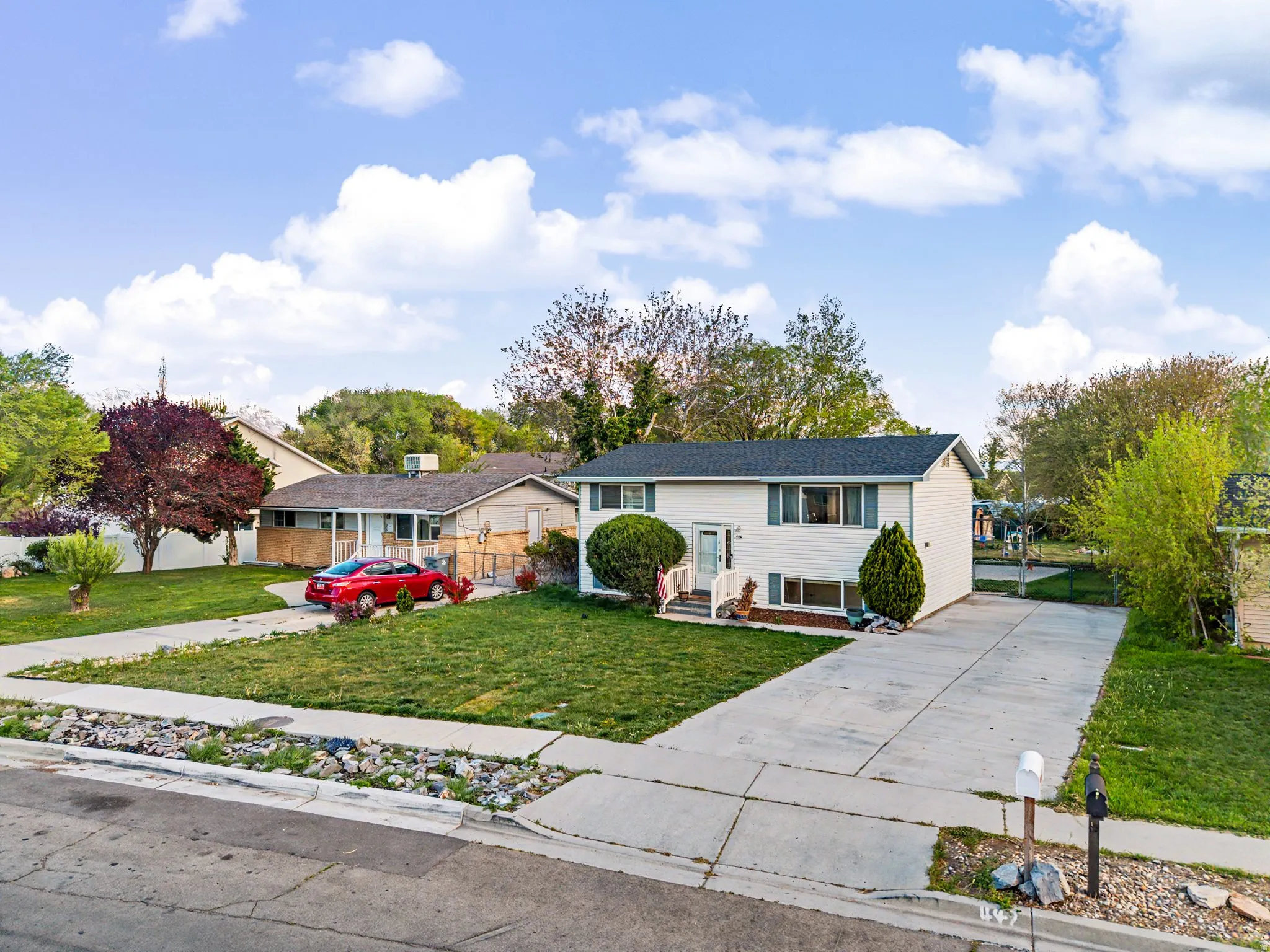 Bi-level home with concrete driveway