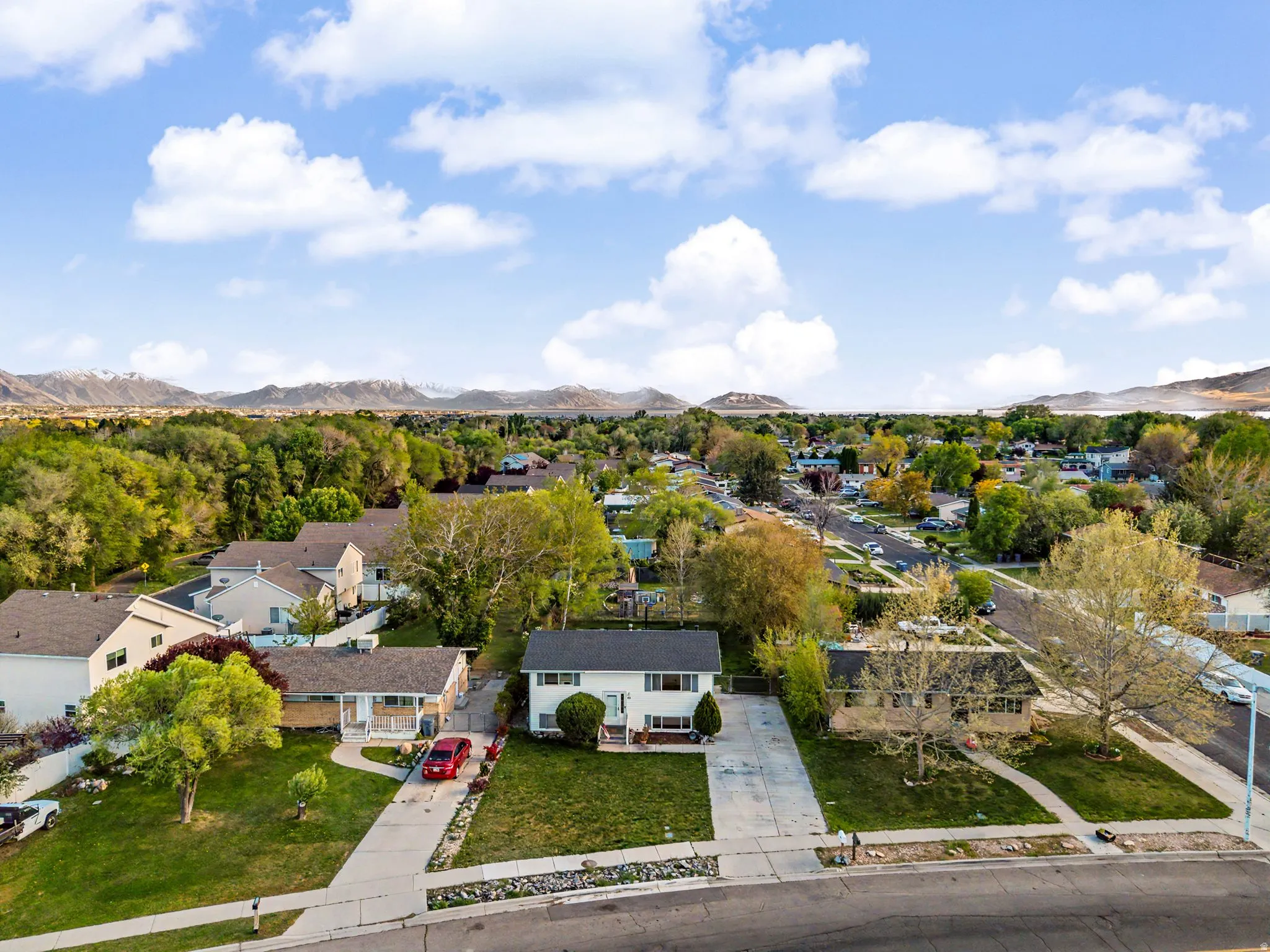 Aerial perspective of suburban area with a mountain backdrop