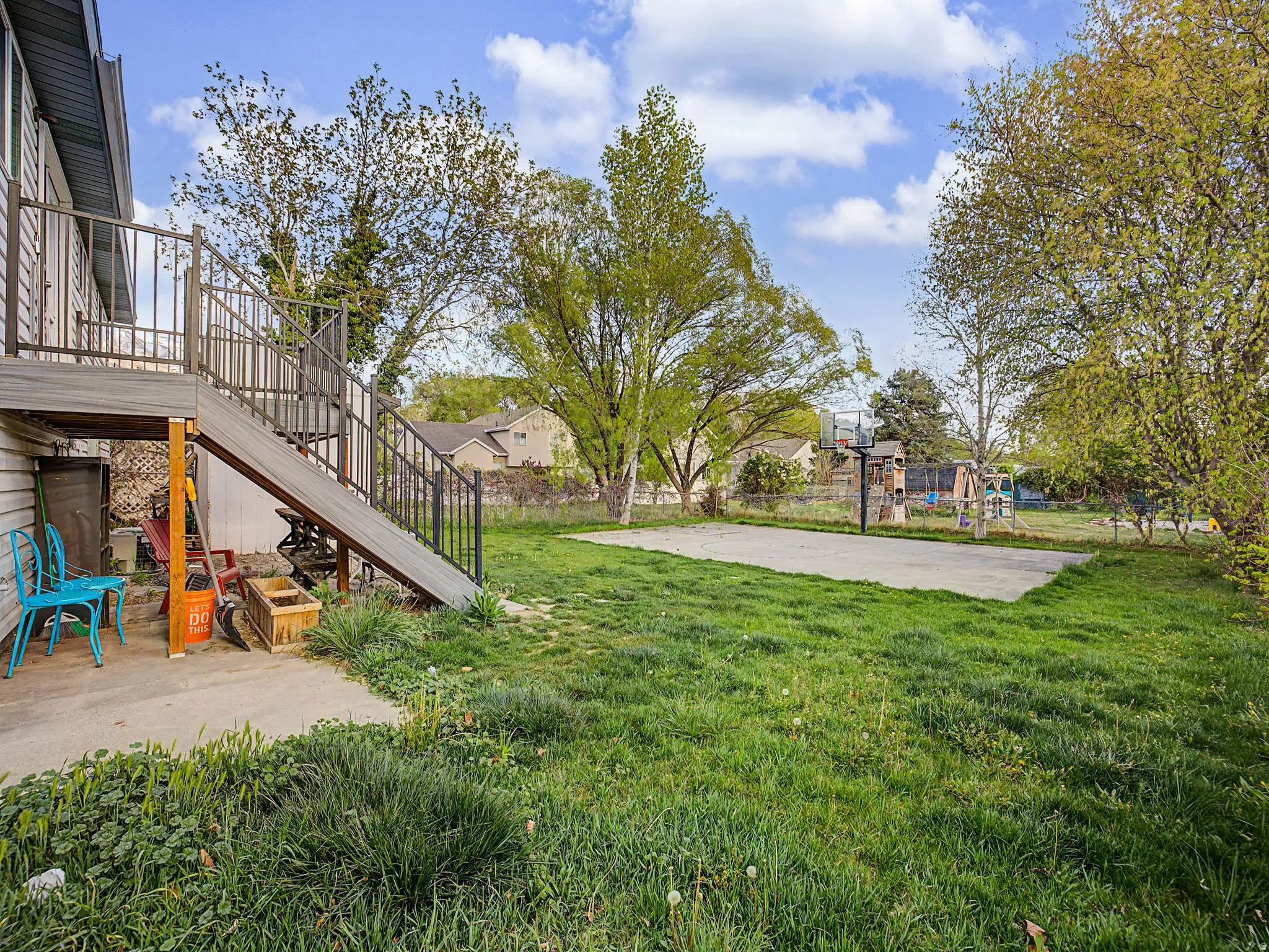 View of yard featuring a playground and a patio area