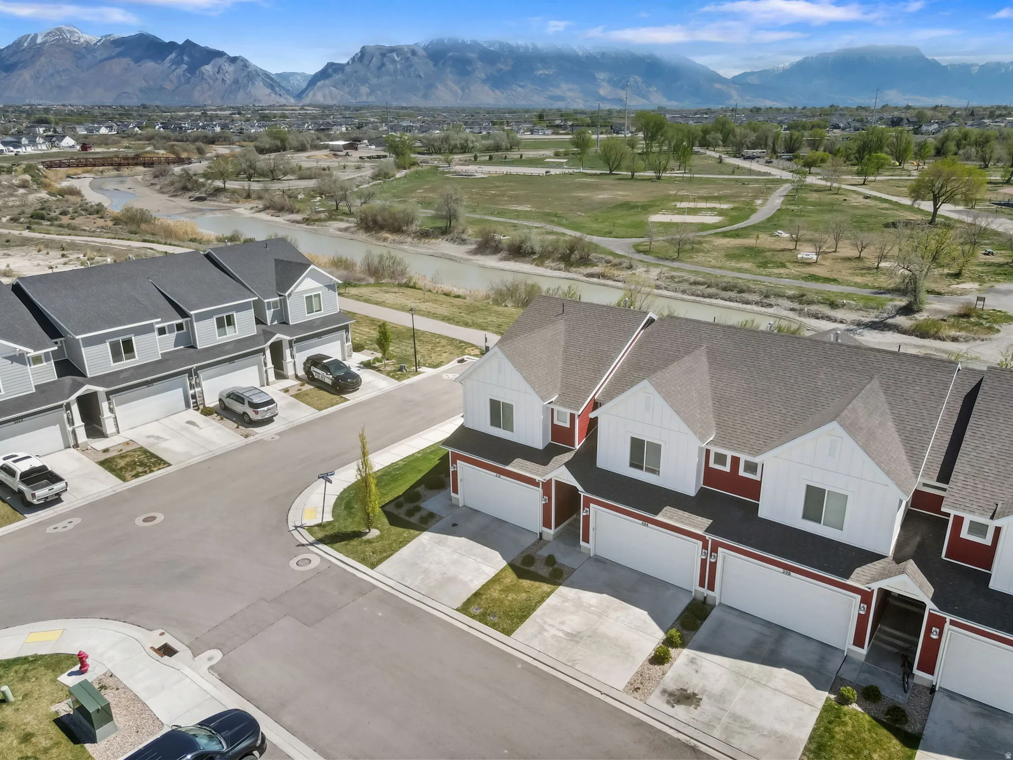 Aerial perspective of suburban area with a mountain backdrop