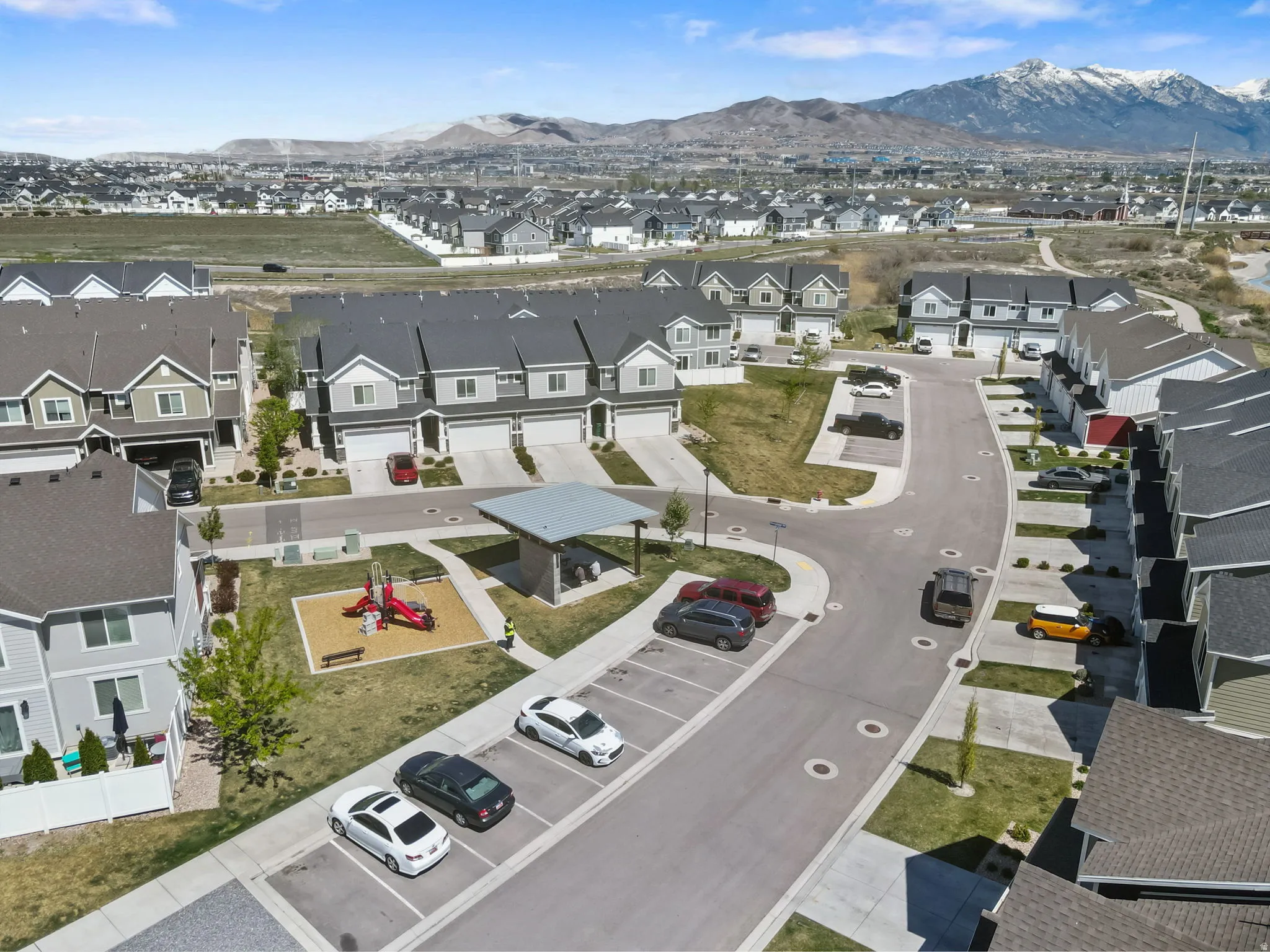 Aerial view of residential area featuring a mountainous background