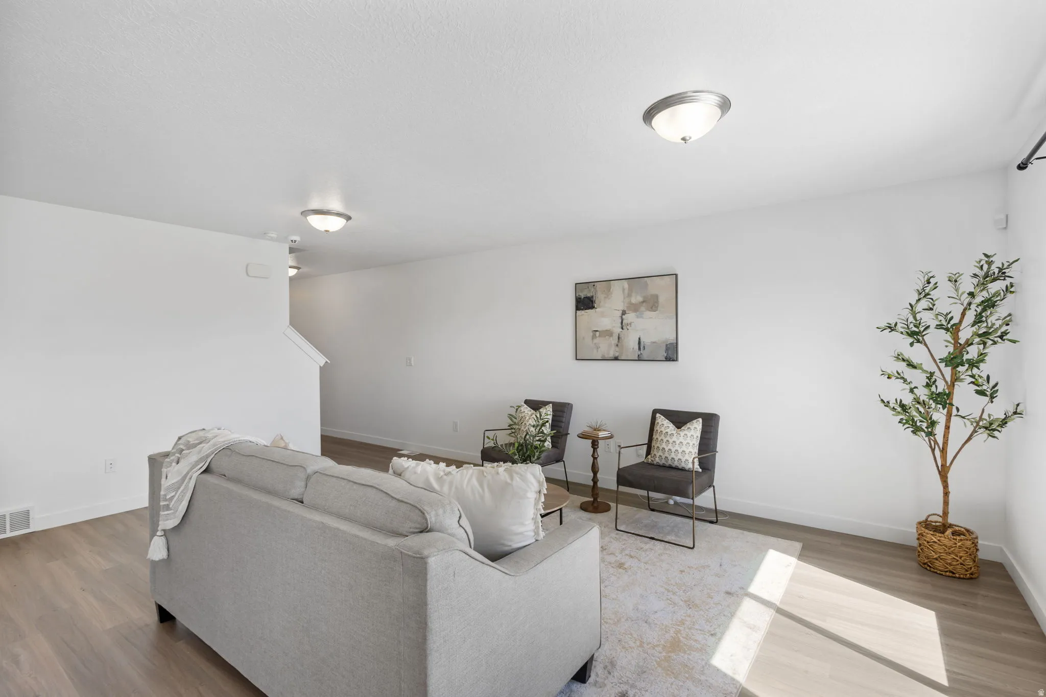 Living room featuring wood finished floors and baseboards