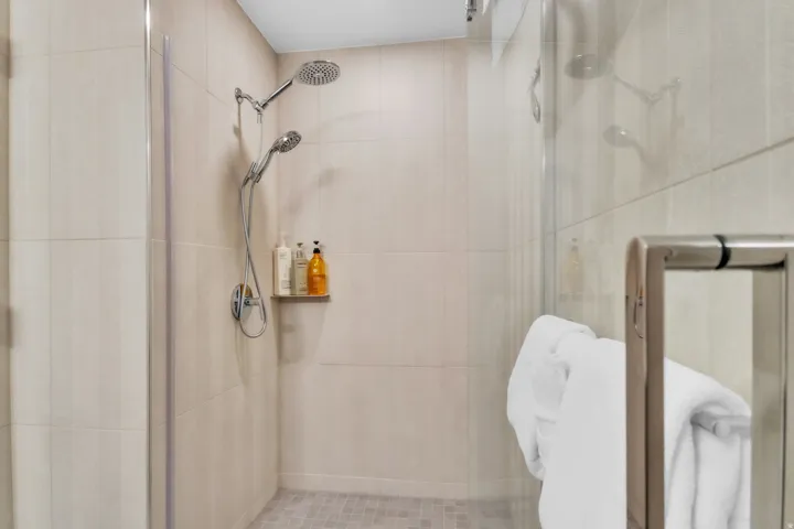 Full bath featuring a shower stall