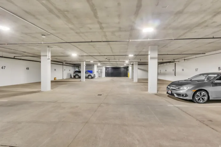 Garage featuring a parking garage