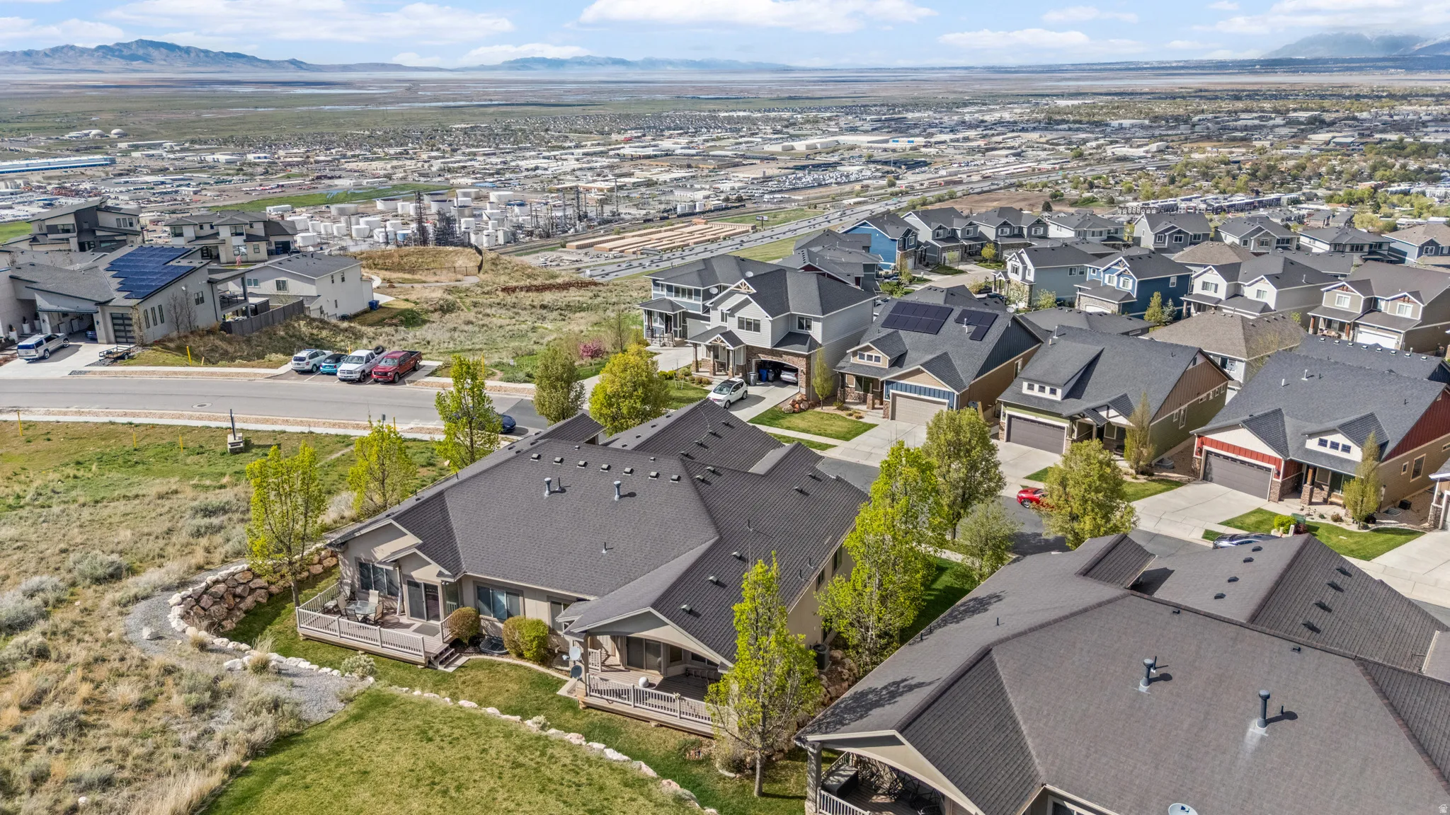 Aerial perspective of suburban area with a mountainous background
