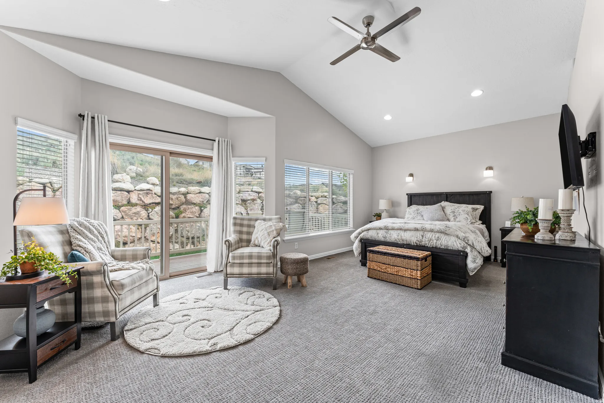 Bedroom with vaulted ceiling, access to exterior, carpet flooring, ceiling fan, and recessed lighting