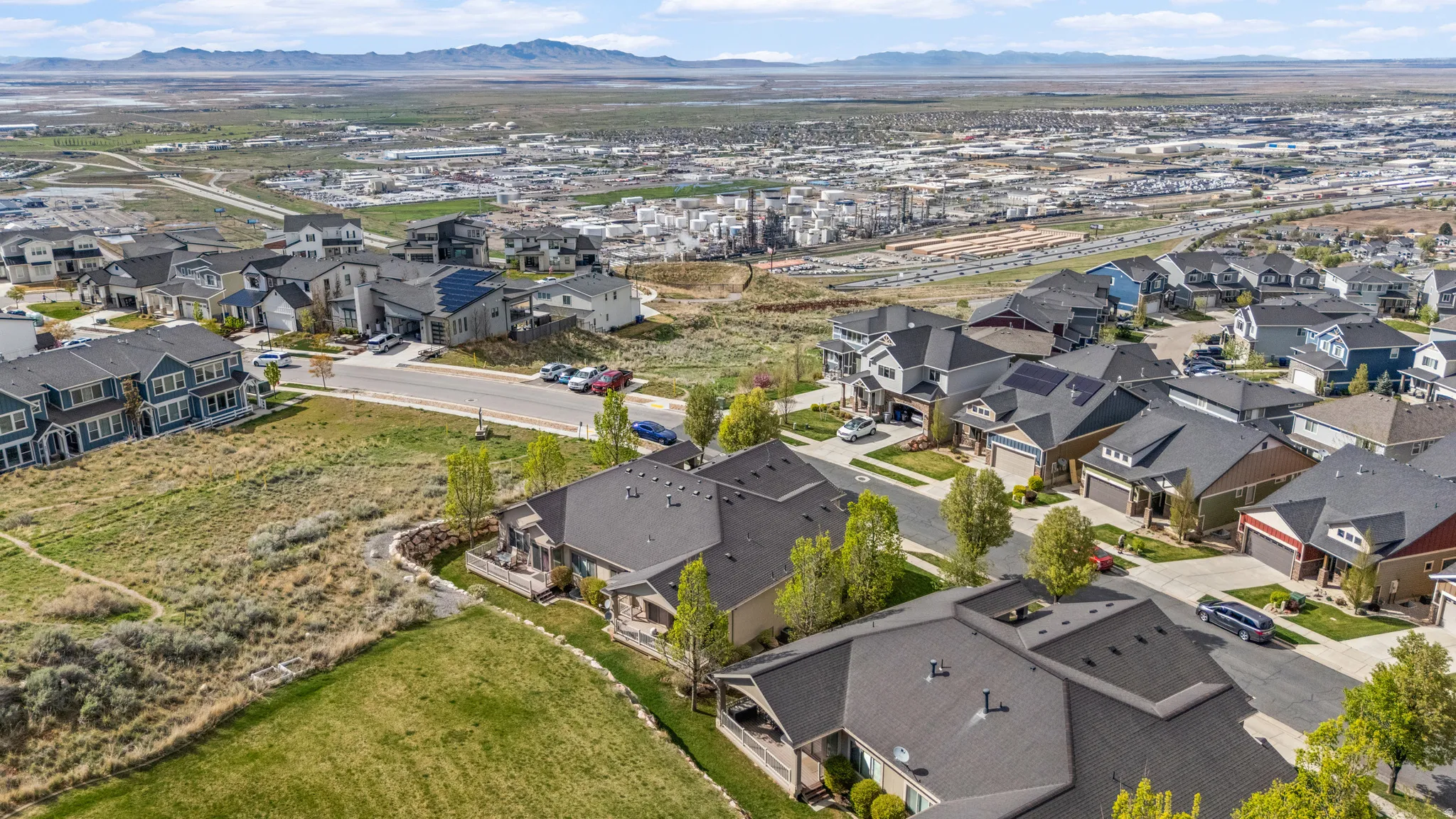 Aerial perspective of suburban area with a mountain backdrop
