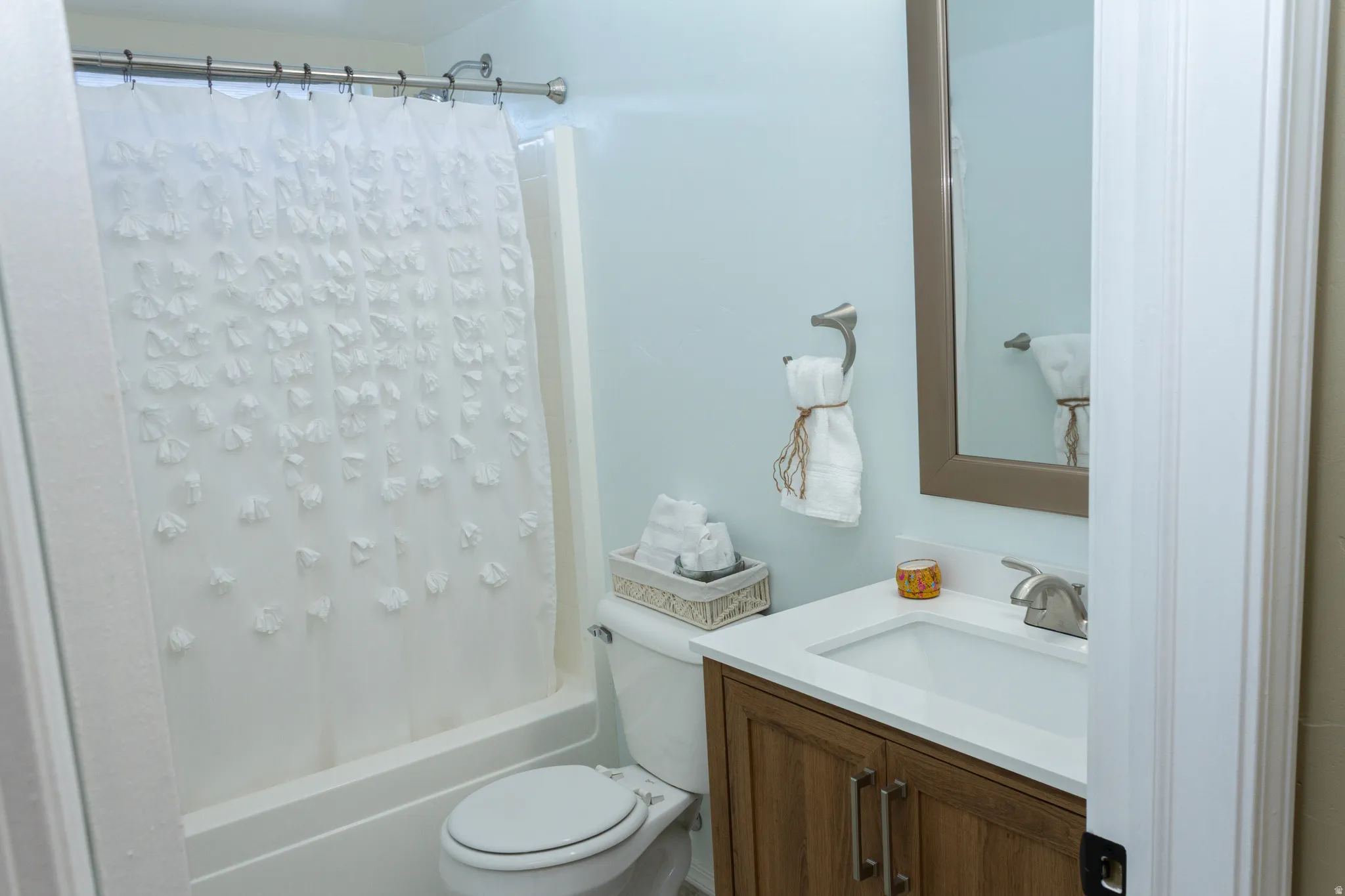 Full bath with vanity and shower / bath combo with shower curtain