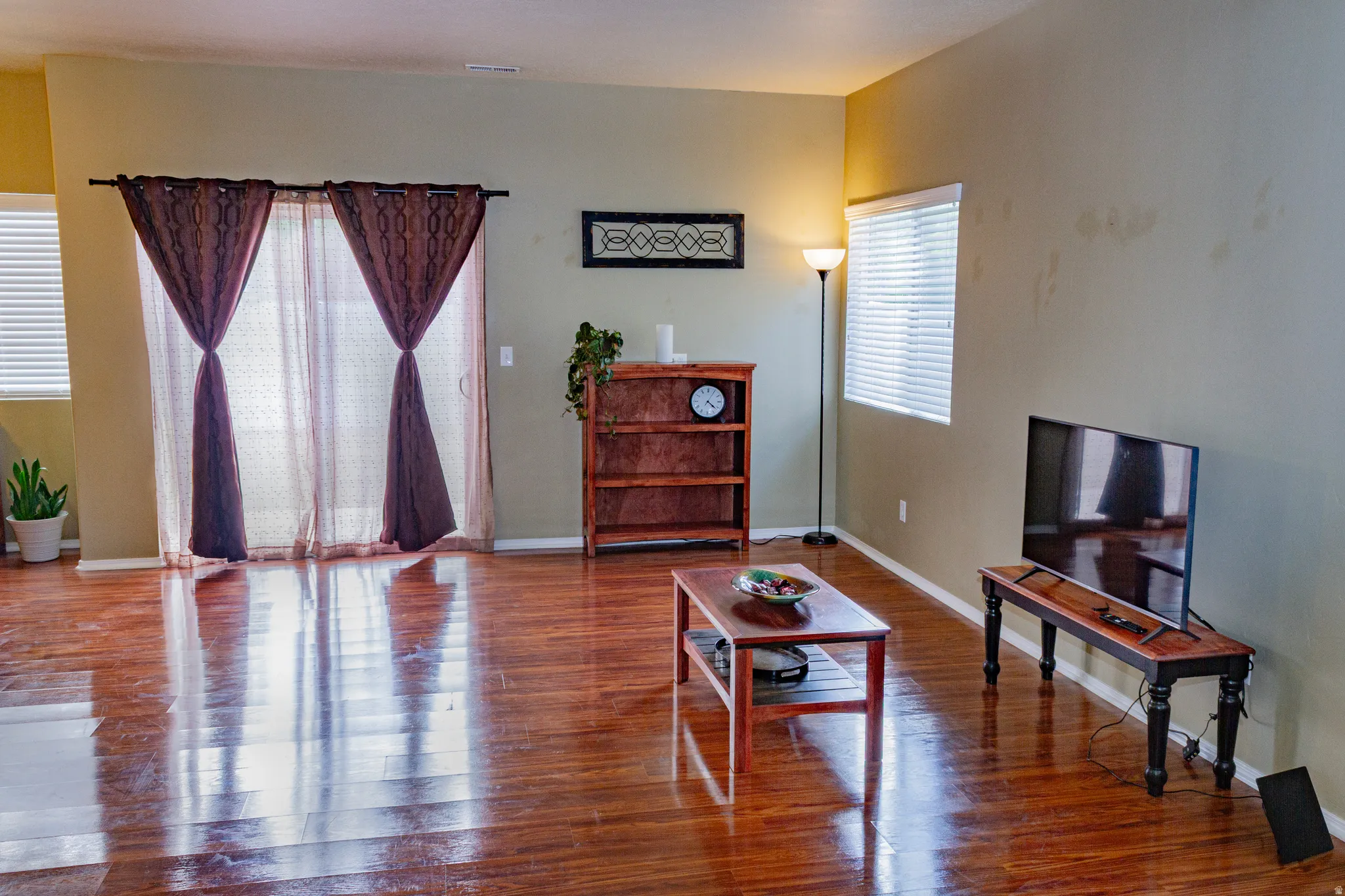Living room with wood finished floors and baseboards
