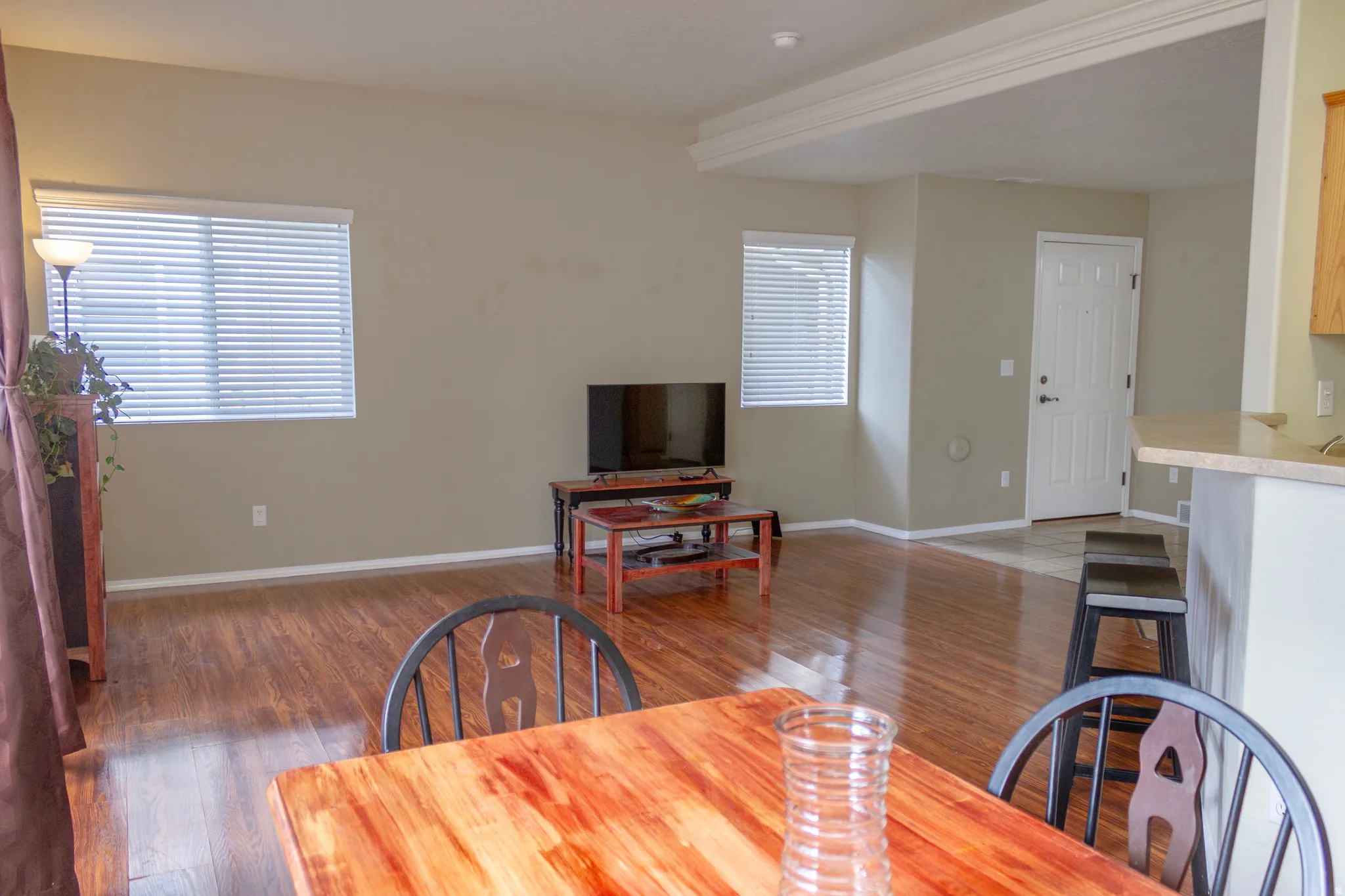 Dining area featuring dark wood finished floors and baseboards