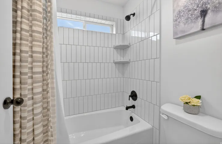 Full bath with toilet and shower / tub combo