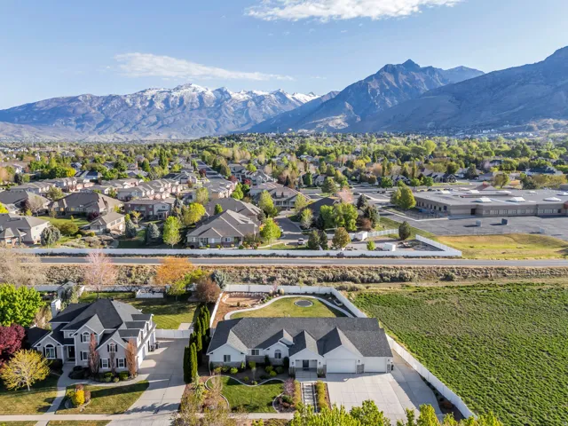 Aerial perspective of suburban area with a mountainous background
