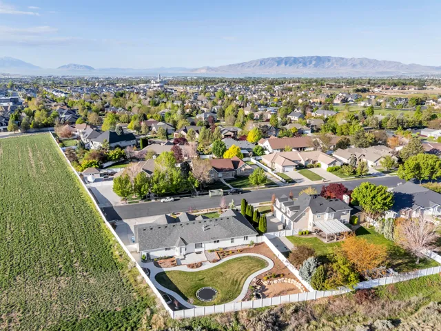 Aerial perspective of suburban area with a mountainous background