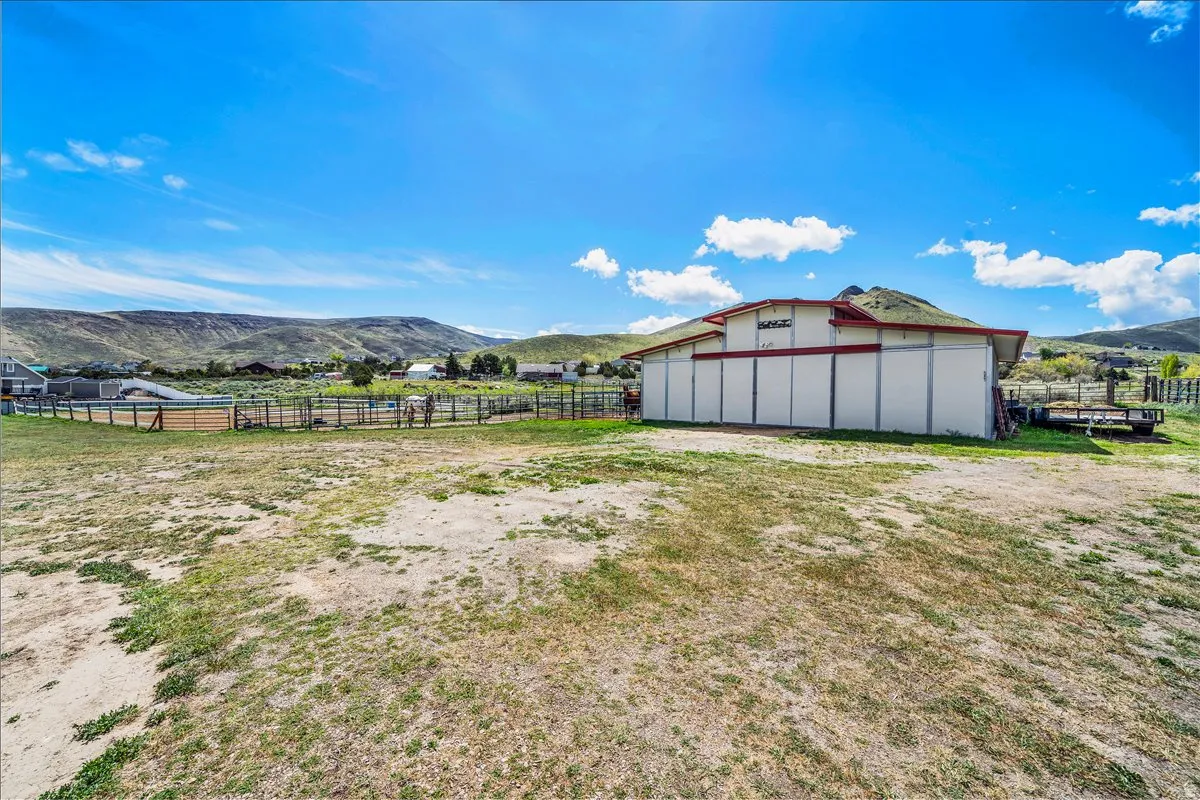 36x36 barn has an arena, 3 stalls, tack room and storage for hay.