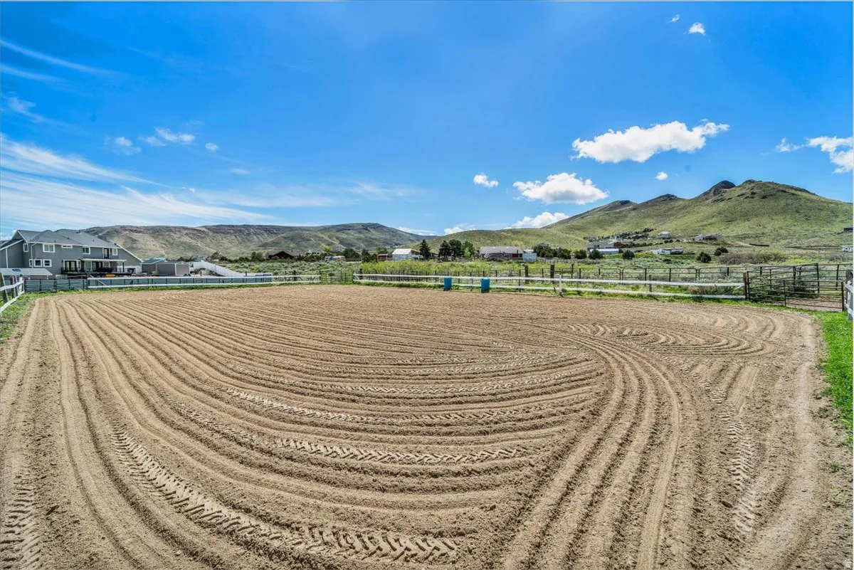 36x36 barn has an arena, 3 stalls, tack room and storage for hay.