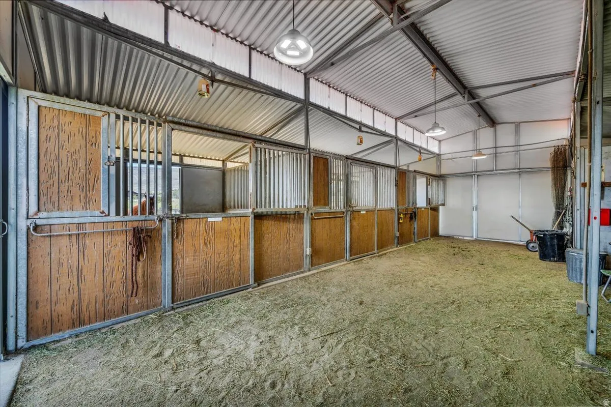 36x36 barn has an arena, 3 stalls, tack room and storage for hay.