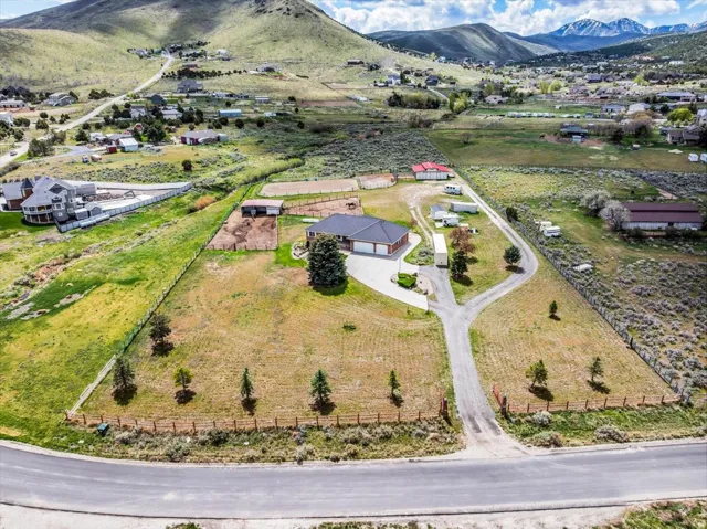 Aerial view of 2.8 fully-fenced, flat lot - you can use every bit of it!