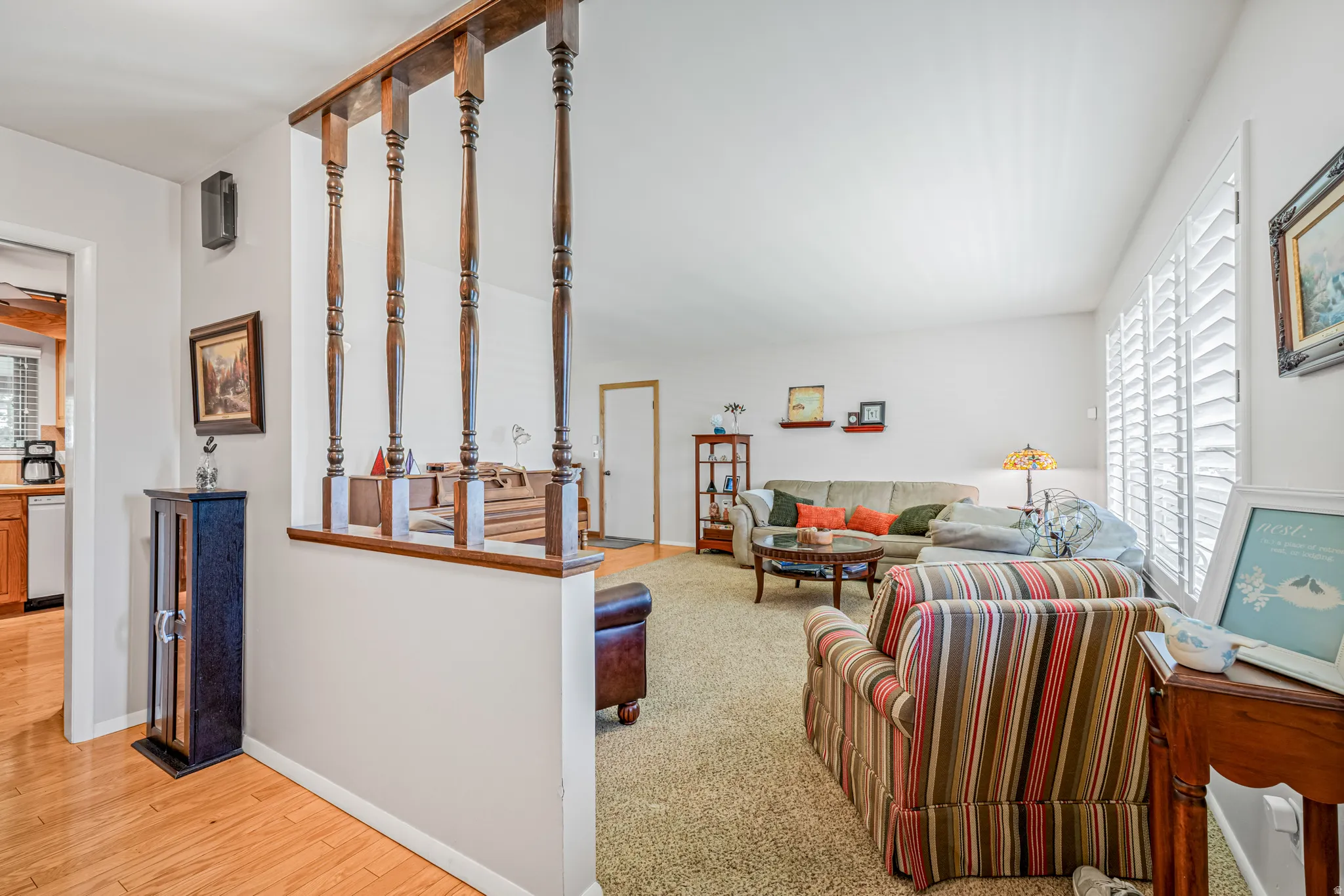 Living area featuring carpet and wood finished floors