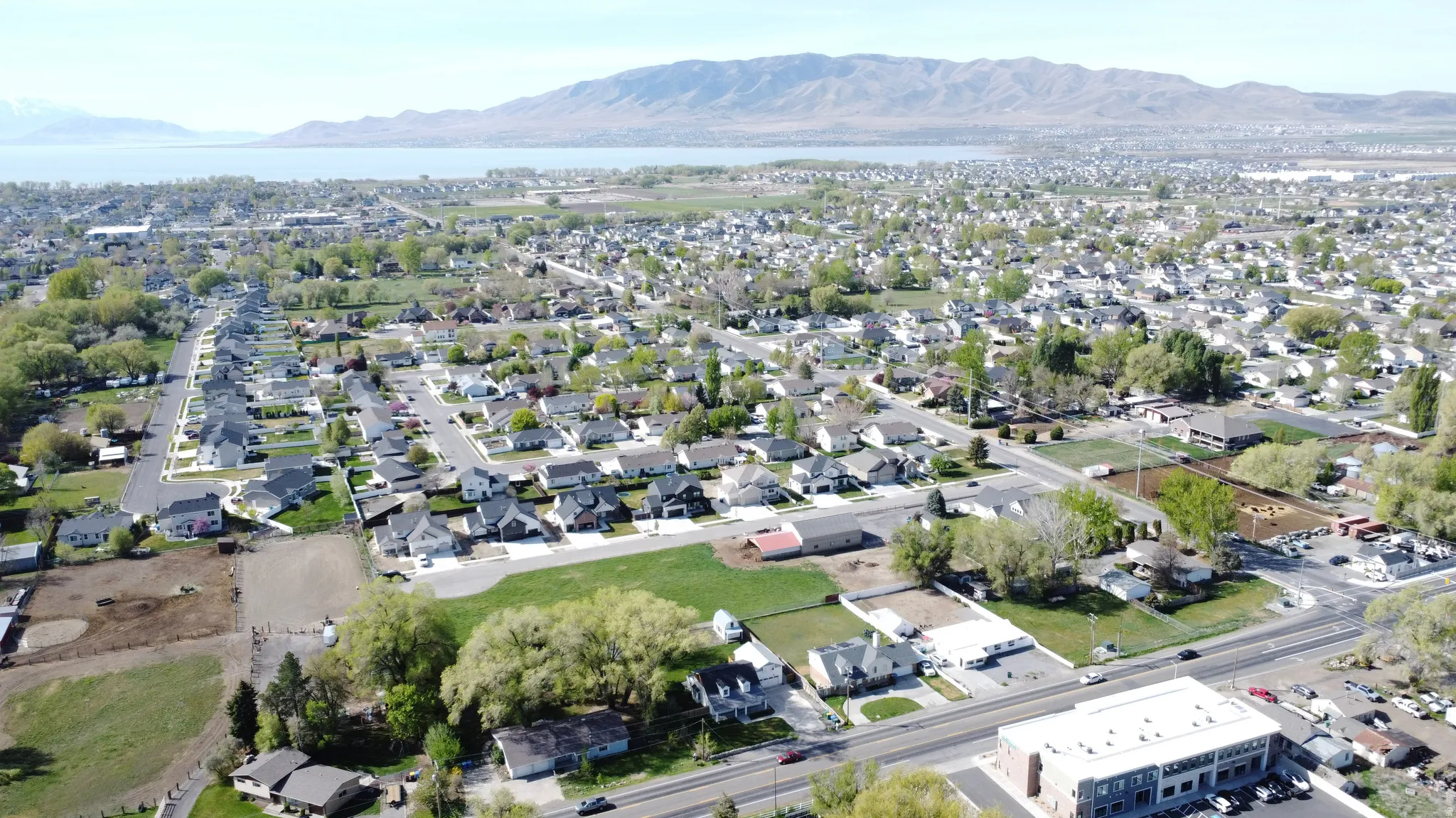 Aerial view of residential area featuring a water and mountain view