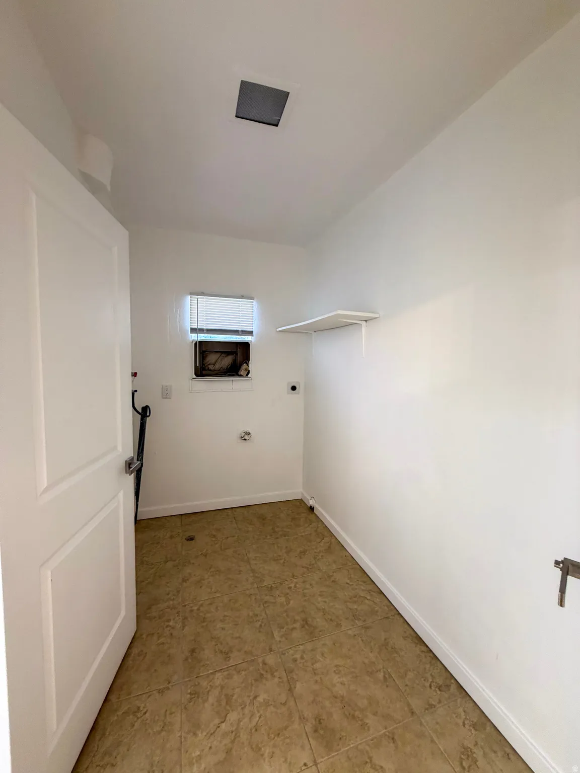 Laundry room with electric dryer hookup and baseboards
