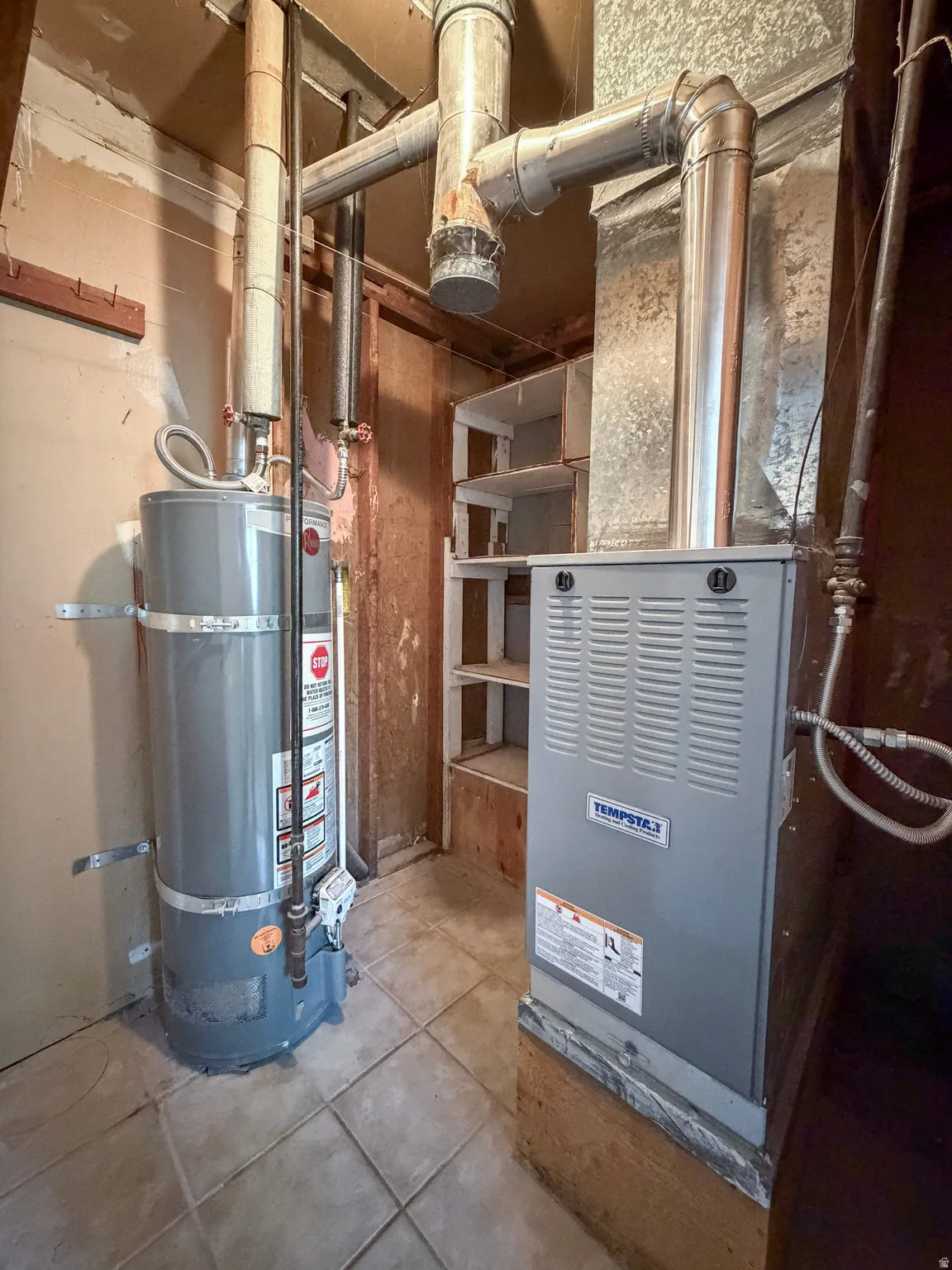 Utilities with strapped water heater and heating unit