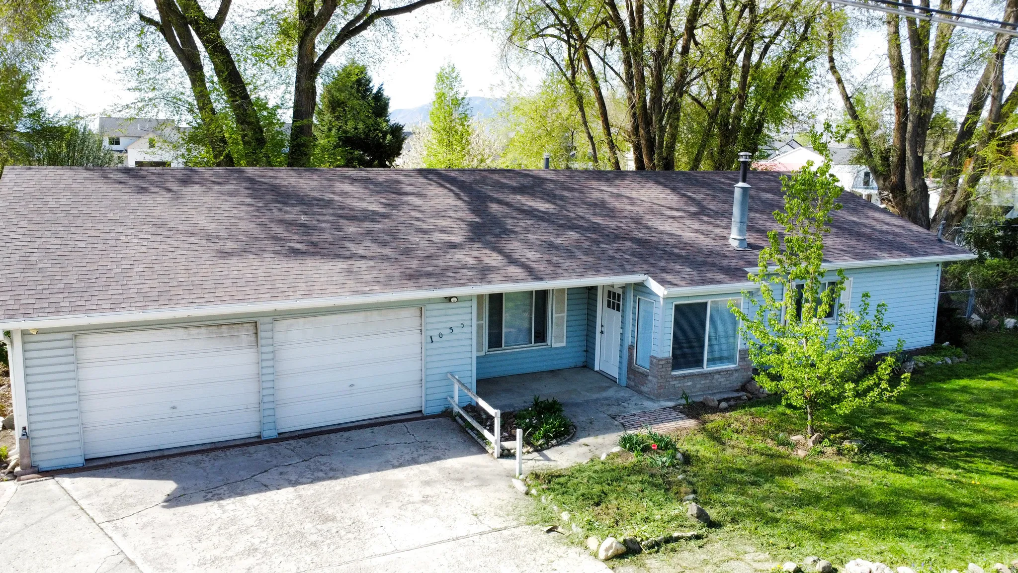 View of front of property featuring roof with shingles
