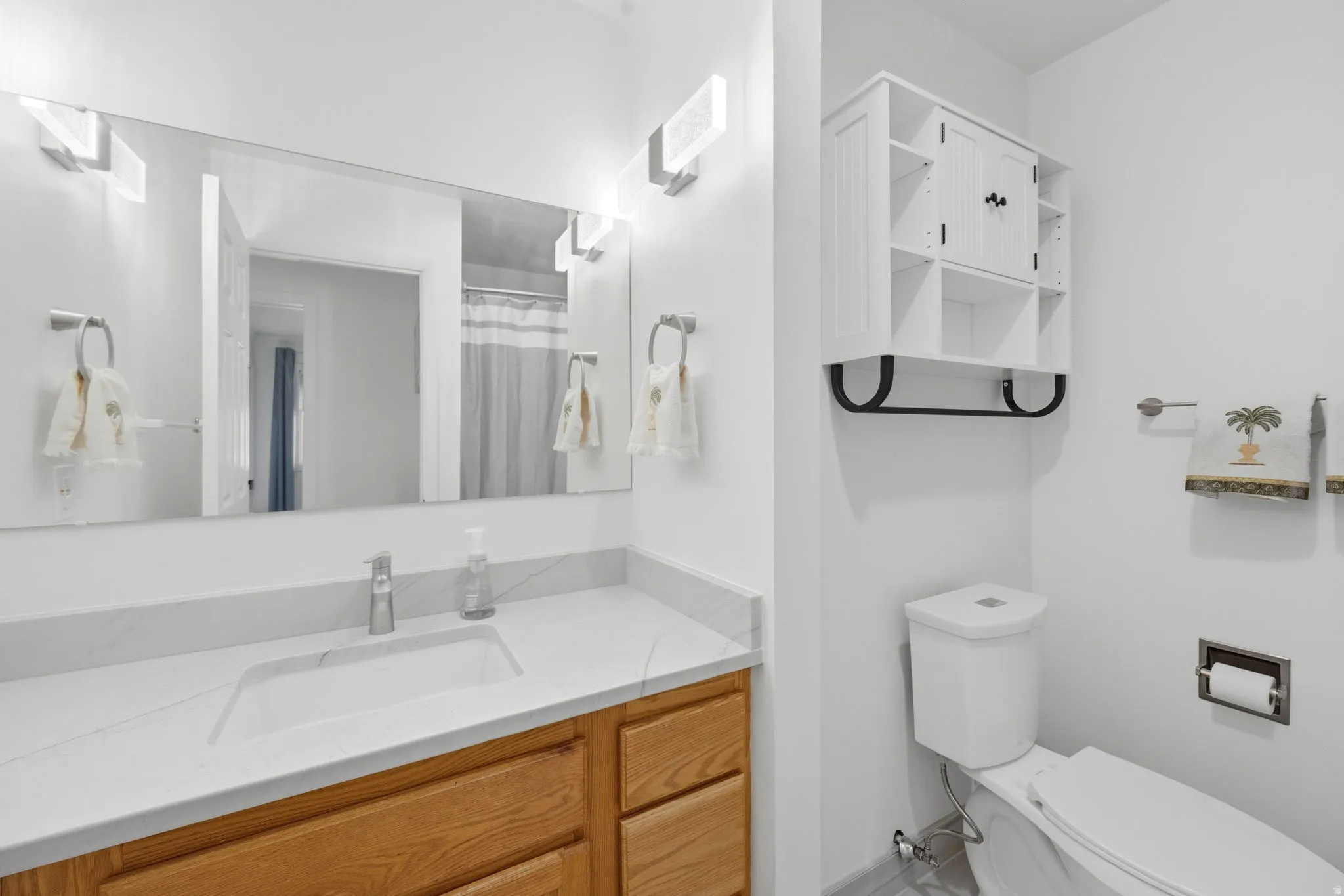 Bathroom with vanity and a shower with curtain