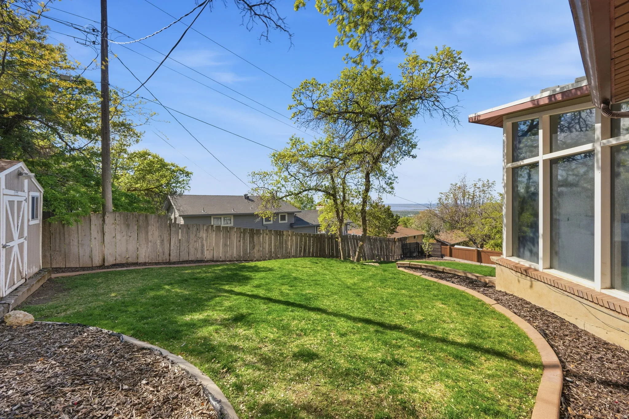 View of fenced backyard