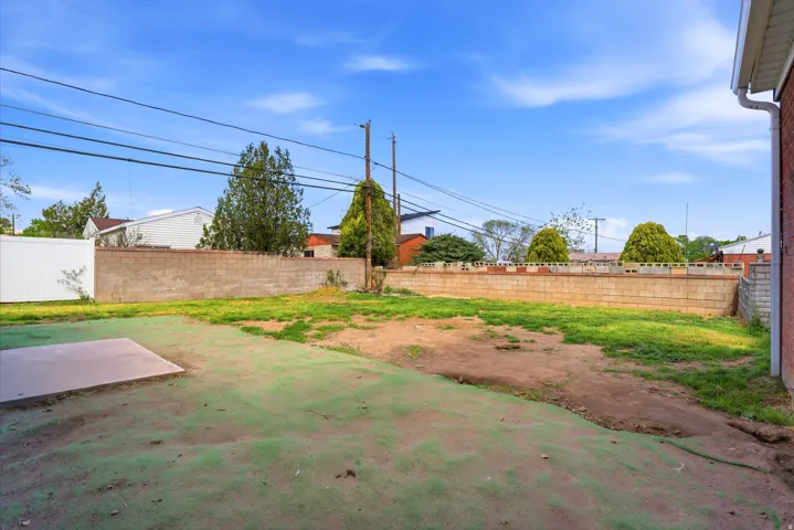 View of fenced backyard