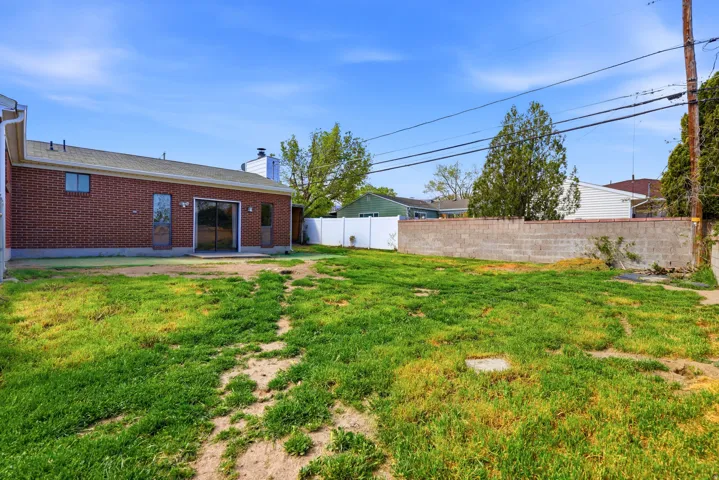 View of fenced backyard