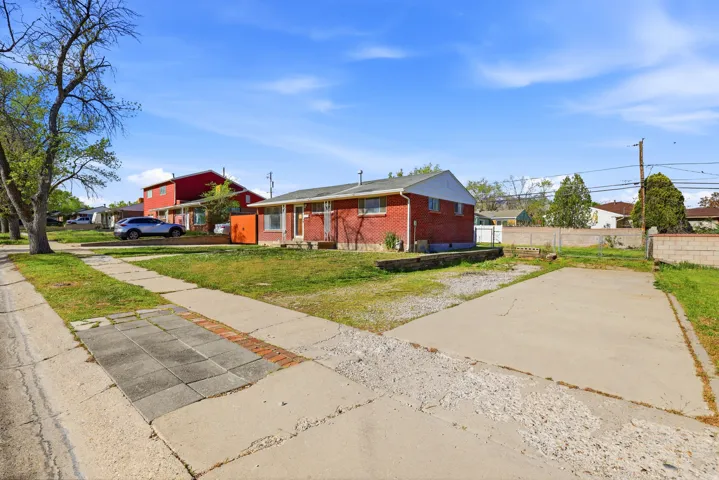 Bungalow-style home with brick siding