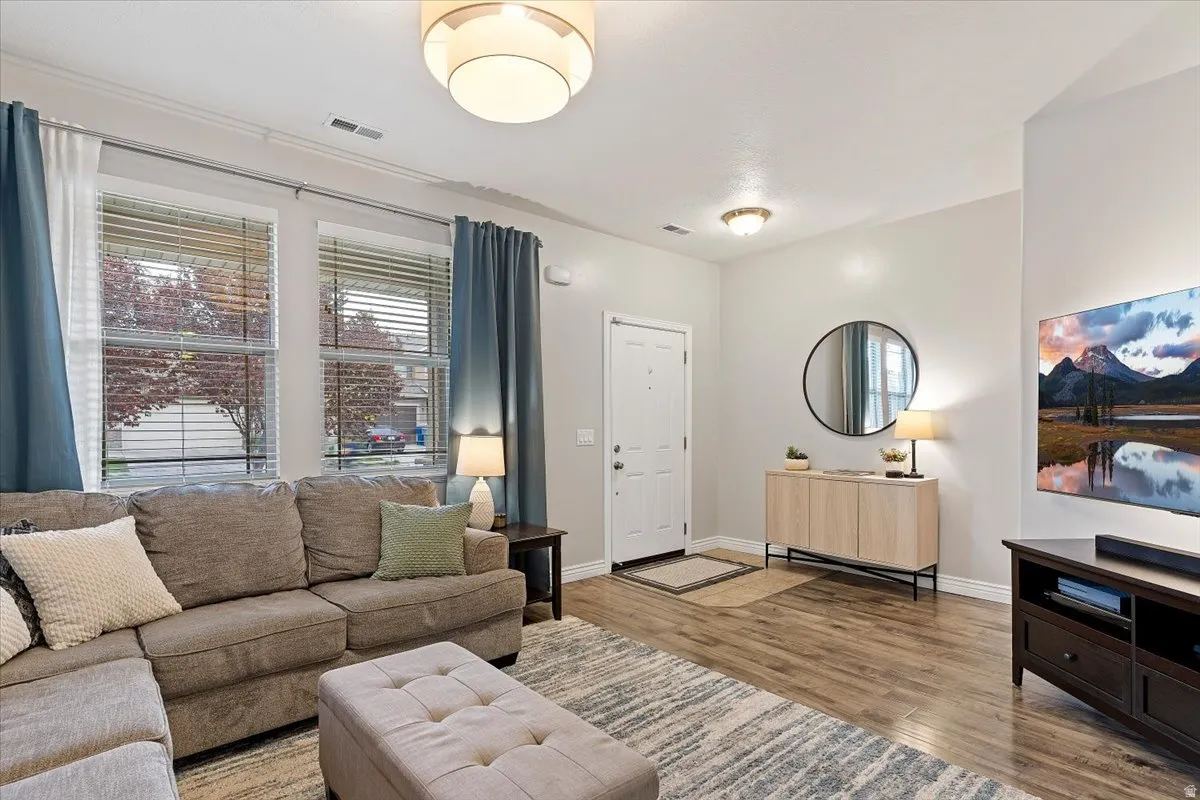 Living area with light wood-type flooring and baseboards