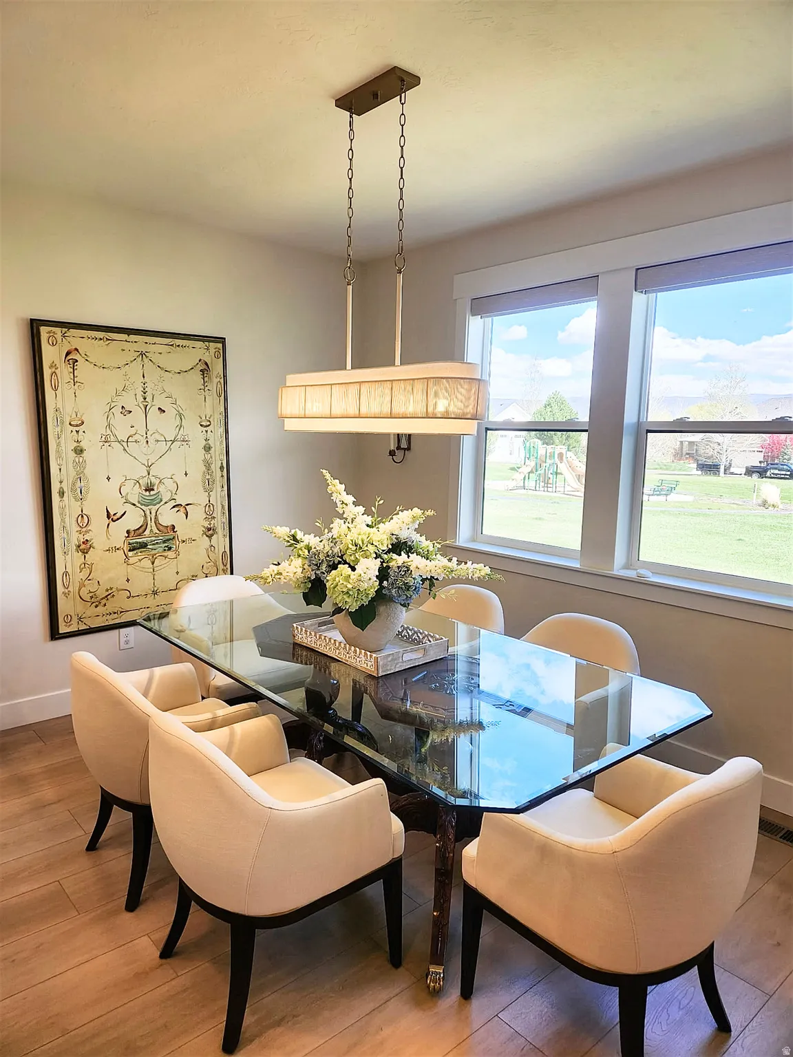 Dining space featuring baseboards and light wood-type flooring