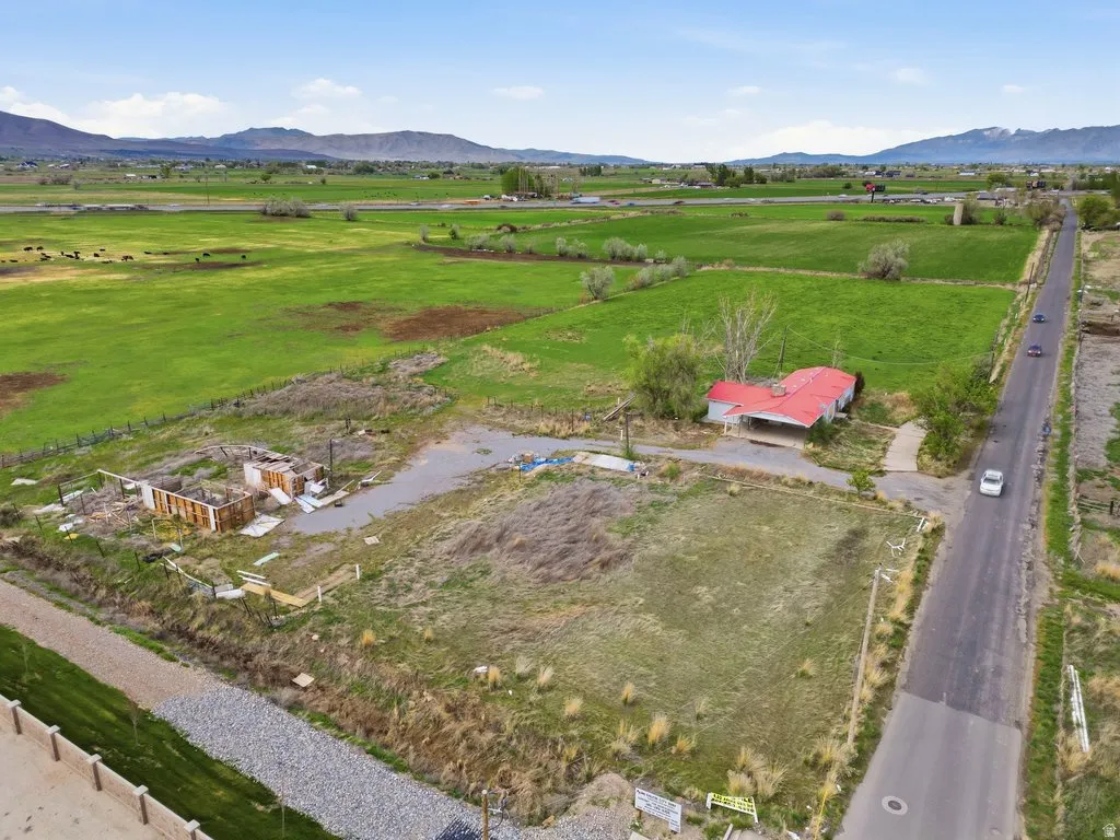 View of rural area featuring a pastoral area and mountains