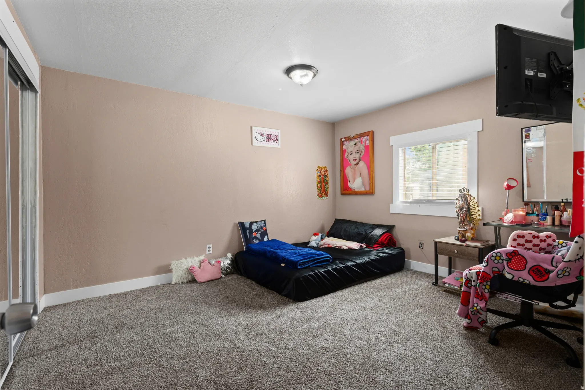 Carpeted bedroom with baseboards